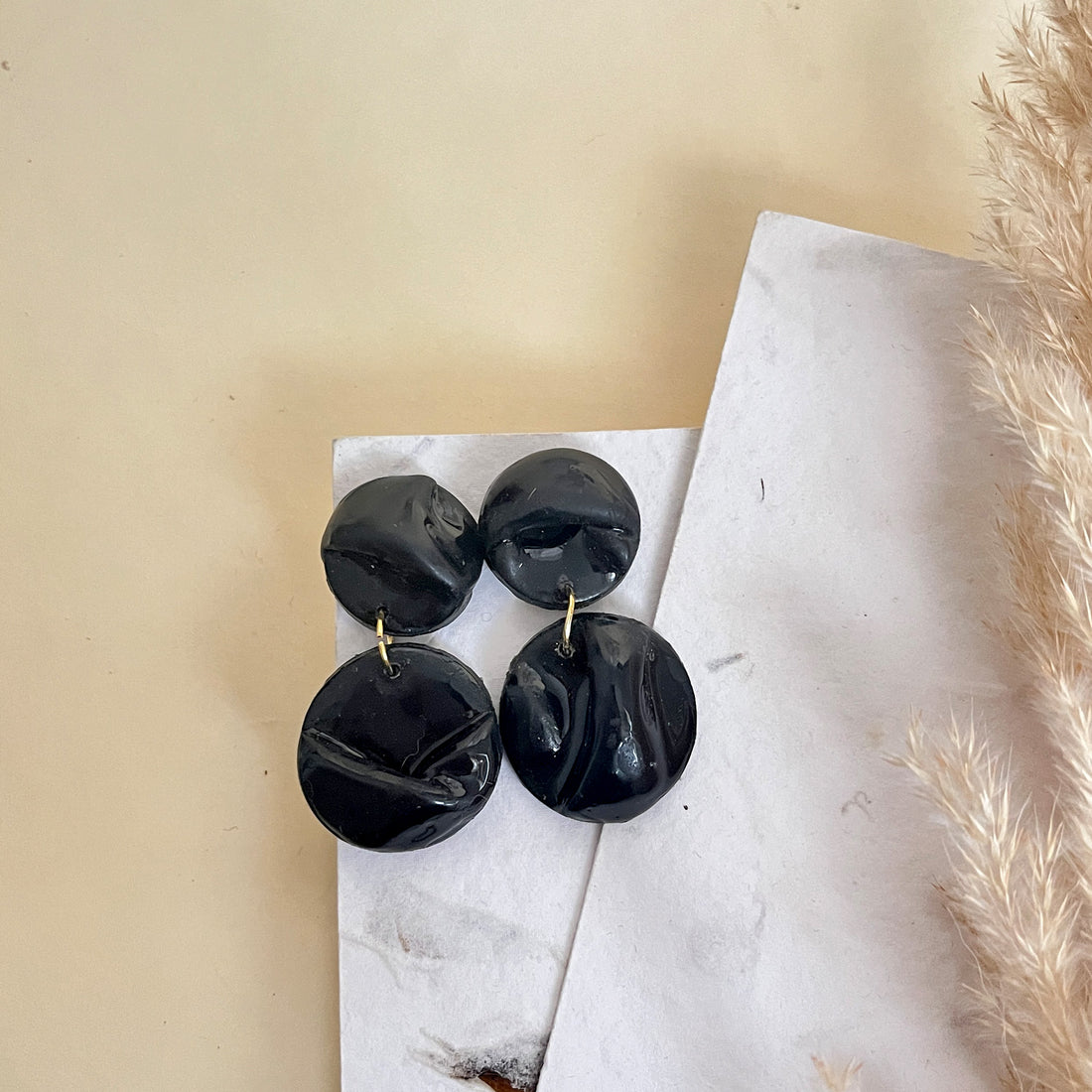 Sculptural double-drop black clay earrings