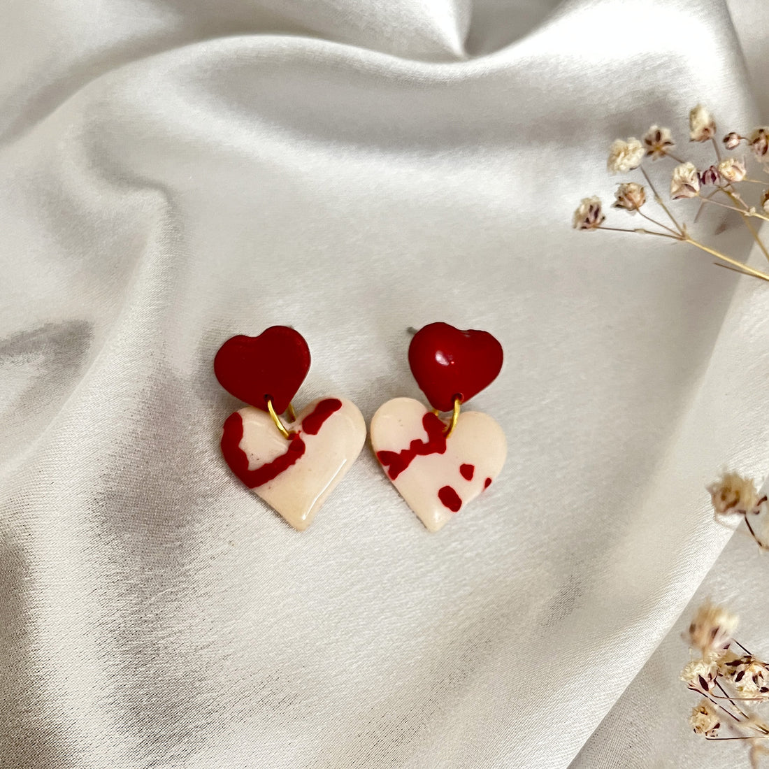 Handmade polymer clay earrings with heart motif