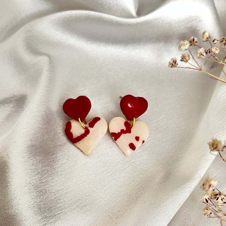 Handmade polymer clay earrings with heart motif