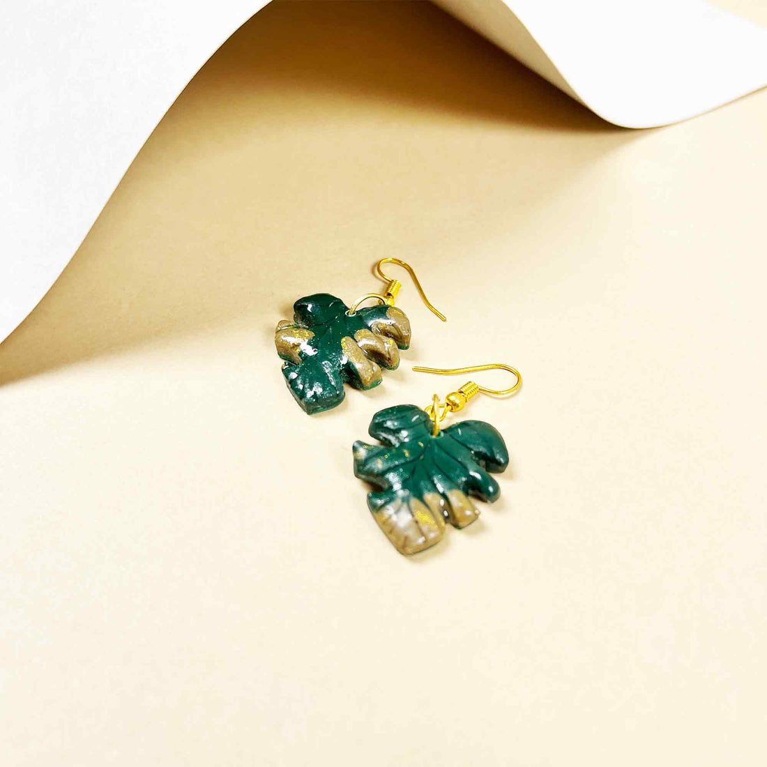 Artistic clay earrings with golden hooks