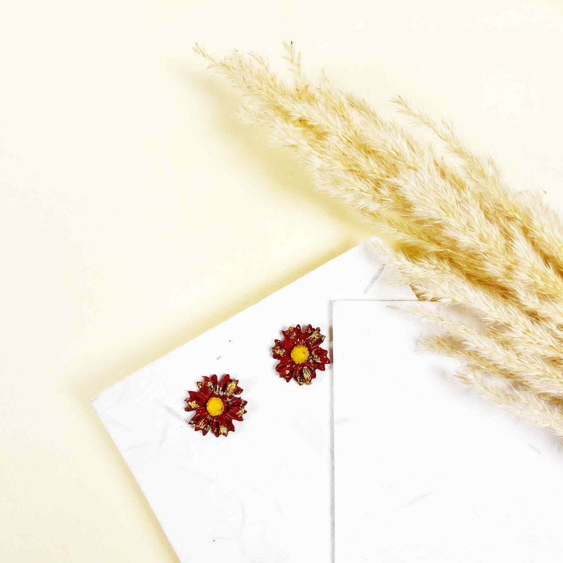 Close-up of sunflower earrings