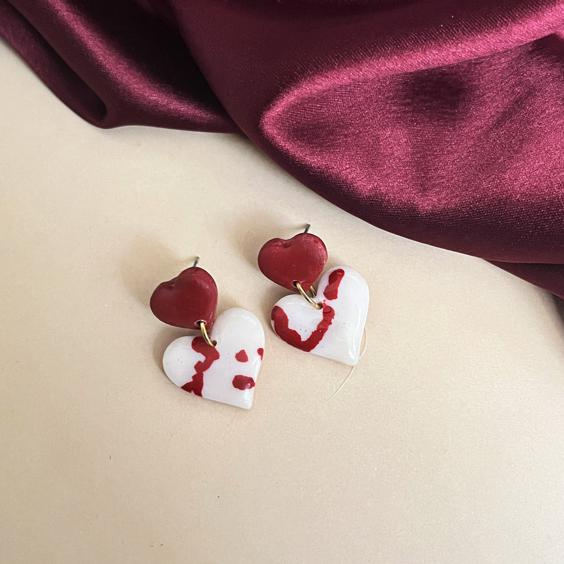 Red and white abstract heart clay earrings