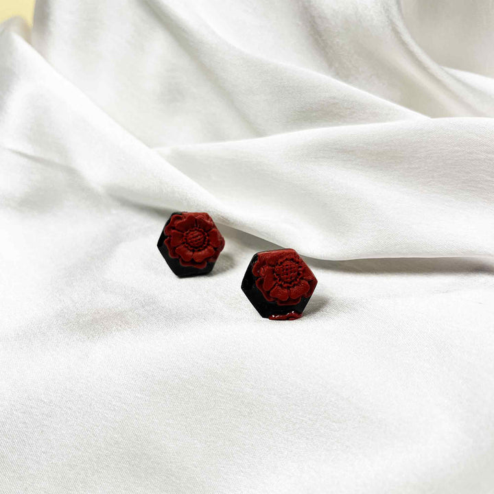 Hexagon-shaped red floral clay earrings