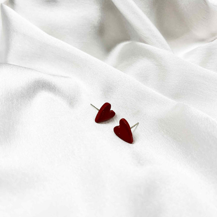 Soft red stud earrings