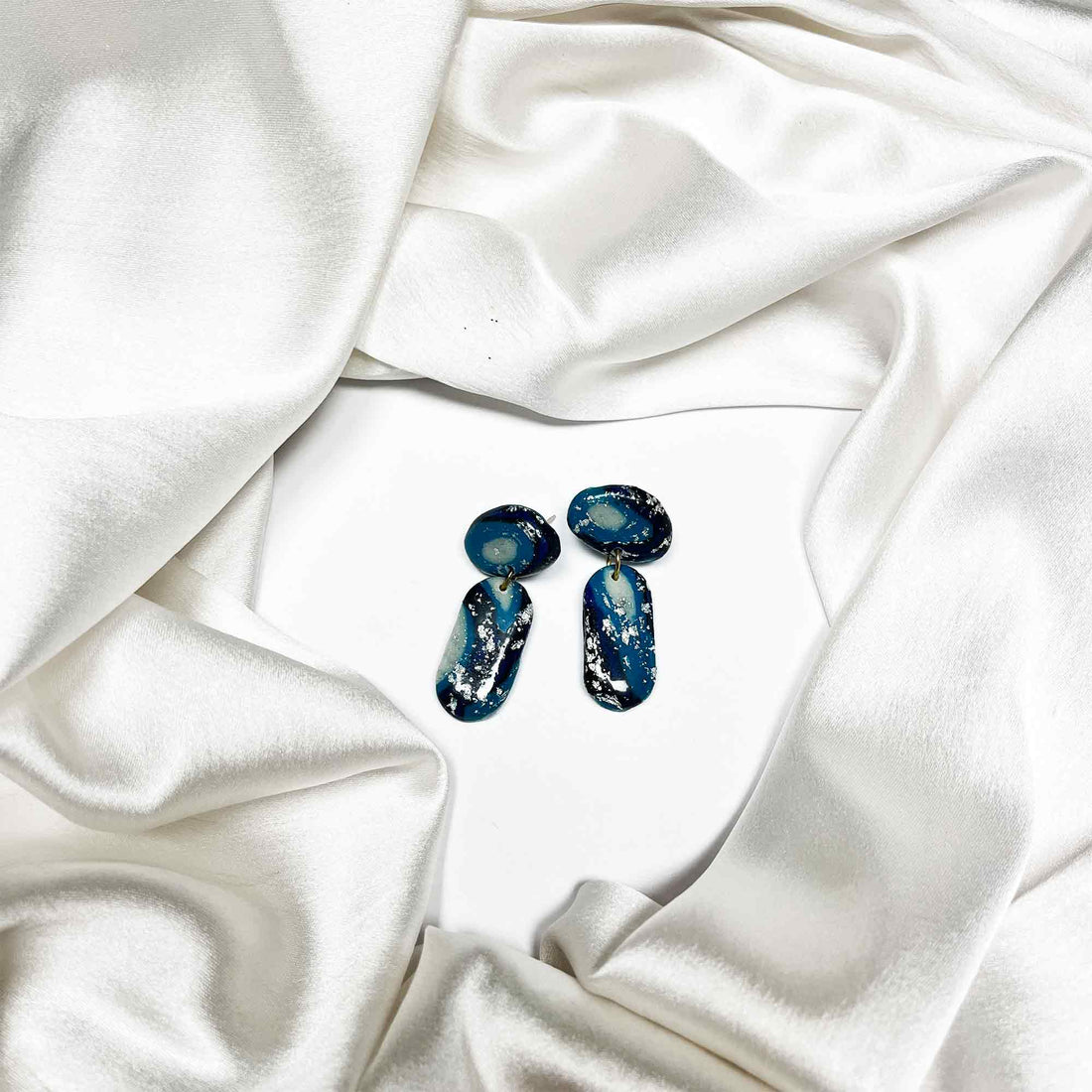 Handmade quirky earrings with blue design