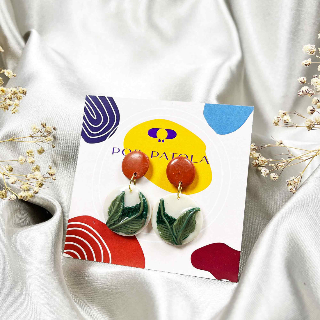 Colorful clay earrings whimsical patterns