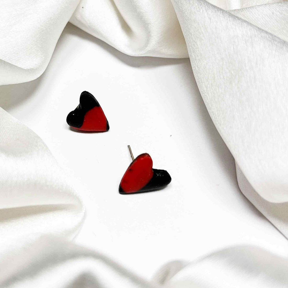 Close-up of red heart earrings