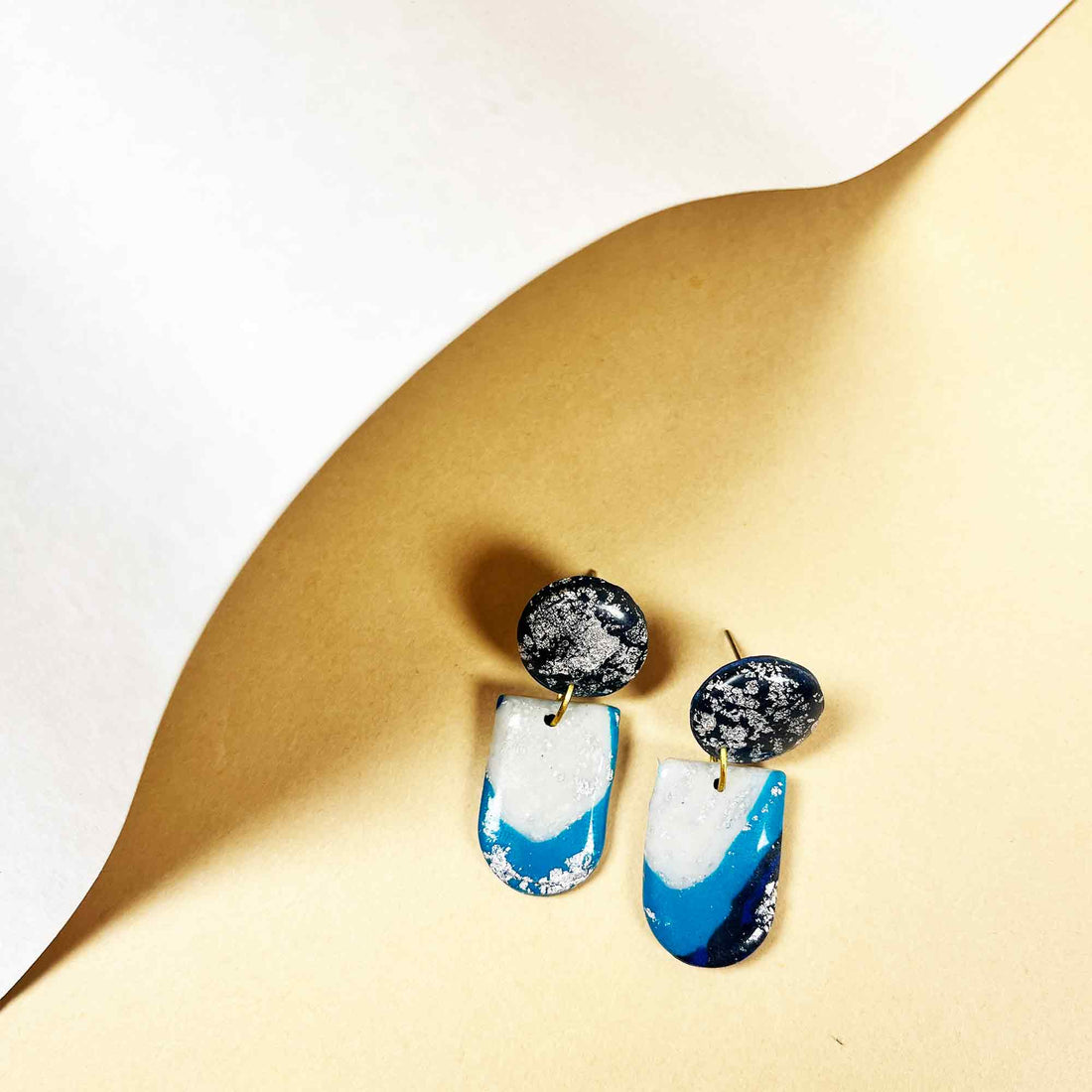 Artistic handcrafted blue earrings with bold design