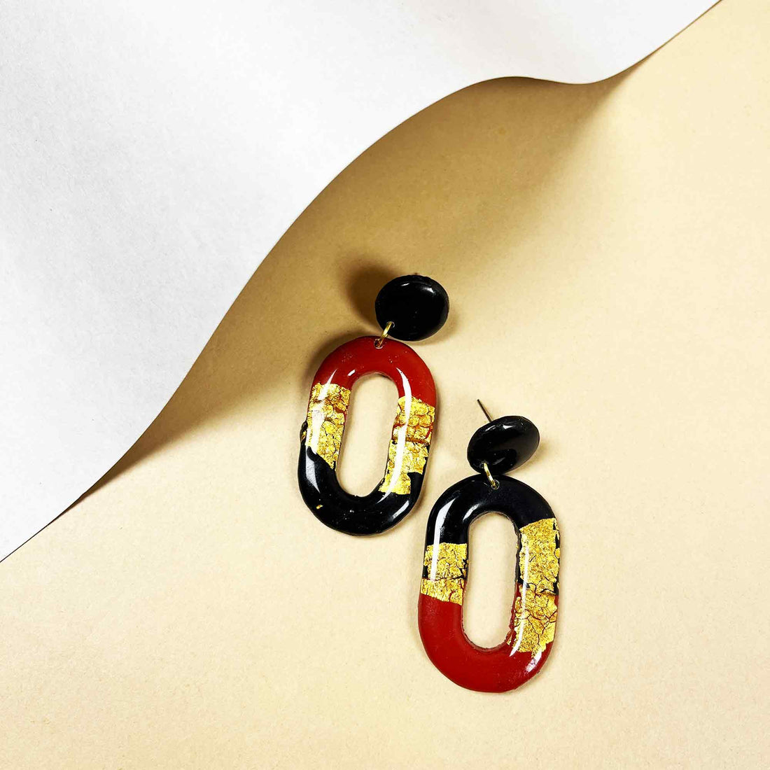 Artistic dangle earrings with gold detailing